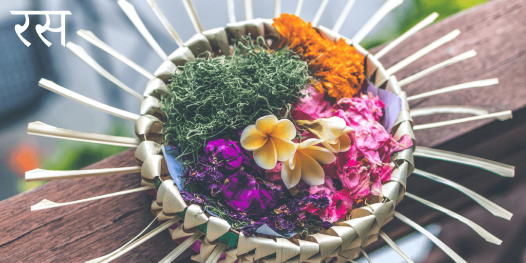 un panier rempli de 6 couleurs de fleurs et de plantes avec le titre sanskrit रस - Rasa